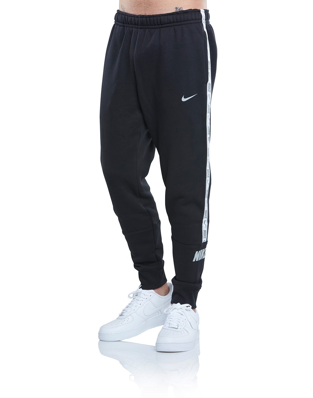 nike track pants mens price